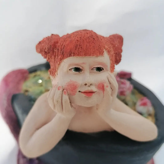 La Petite Baigneuse contrariée dans son bain de nénuphars by Sandrine De Zorzi